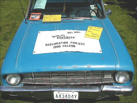 1967 Ford Ranchero - A blue 1960 Ford Falcon is displayed with a banner detailing its restoration project.