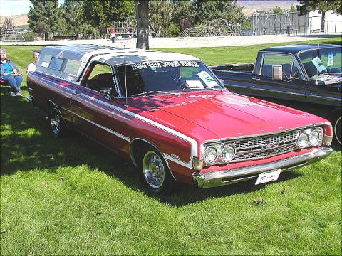 1967 Ford Ranchero - Red 1967 Ford Ranchero with a white camper shell and chrome trim, parked at an outdoor event.