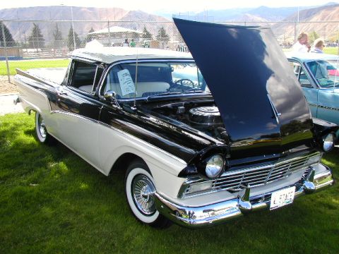 1967 Ford Ranchero - This two-tone 1957 Ford Fairlane 500 Ranchero is displayed with its hood open, revealing the engine bay.