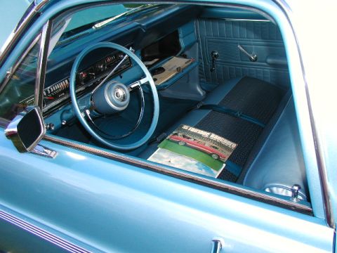 1967 Ford Ranchero - The interior of a 1967 Ford Ranchero is visible, complete with a magazine on the seat.
