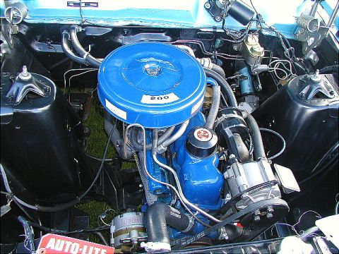 1967 Ford Ranchero - The engine bay of a 1967 Ford Ranchero, showing the "200" engine with blue accents and an Auto-Lite alternator.