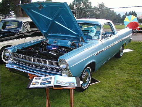 1967 Ford Ranchero - Light blue 1967 Ford Ranchero on display with hood open, parked next to a black and white car.