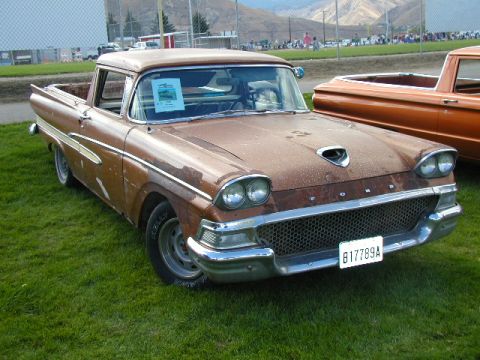 1967 Ford Ranchero - This 1959 Ford Ranchero is seen at an outdoor event next to another vehicle.