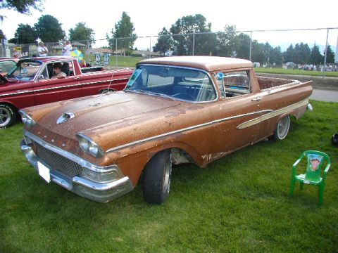 1967 Ford Ranchero - Two Ford vehicles, a 1959 Ranchero and a red Falcon, parked on grass.