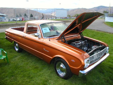 1967 Ford Ranchero - This classic pickup truck has its hood open, revealing the engine compartment.