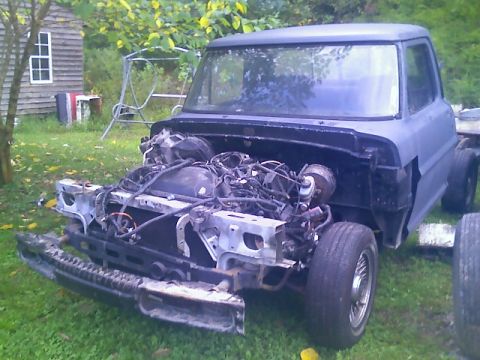 2002 Ford Crown Victoria - This truck's front end is disassembled, revealing the engine and chassis components.
