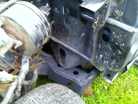 2002 Ford Crown Victoria - The photo shows a portion of a vehicle's chassis, including the brake booster and frame components.