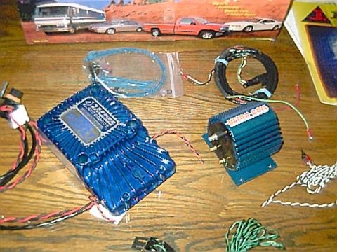 1994 Ford Bronco - Two automotive electronic components, possibly for ignition systems, are laid out on a table.
