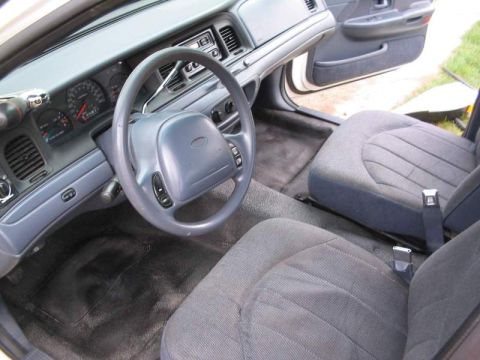 1998 Ford Crown Victoria - The interior of a 1998 Ford Crown Victoria is shown, the driver's side dashboard and front seating area.