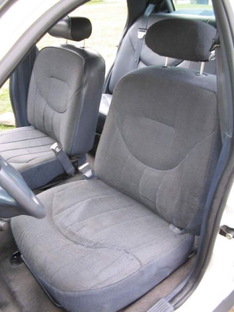 1998 Ford Crown Victoria - The interior of a 1998 Ford Crown Victoria shows gray cloth front seats and headrests.