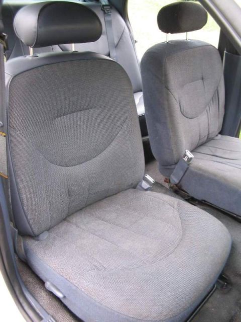 1998 Ford Crown Victoria - Interior view of the front seats and headrests of a vehicle.