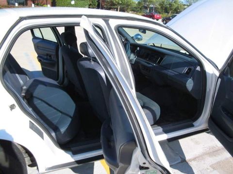 1998 Ford Crown Victoria - Interior view of a 1998 Ford Crown Victoria with all doors open.