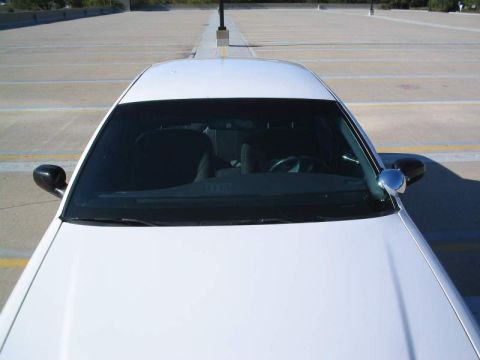 1998 Ford Crown Victoria - A white 1998 Ford Crown Victoria is seen from a high angle in a parking lot.
