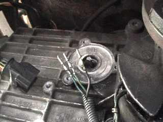 1991 Ford Bronco - This image shows a close-up view of a vehicle transmission component, including wiring and a connector. The registry information may be ina…