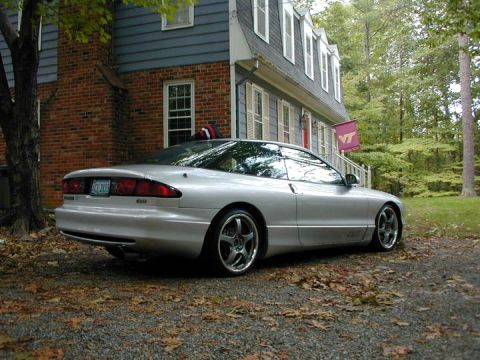 1993 Ford Probe - A silver 1993 Ford Probe coupe is parked in a driveway with fallen leaves around it.