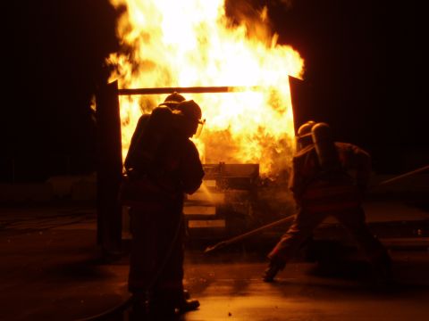 1981 Ford Bronco - Firefighters practice extinguishing a blaze during a training exercise.