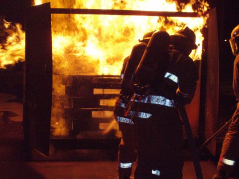 1981 Ford Bronco - Firefighters practice their skills in a controlled burn environment during a training exercise.