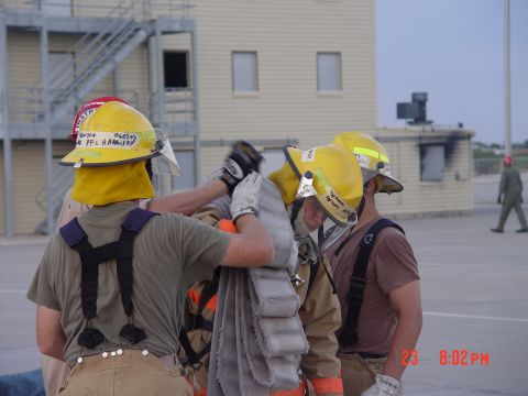 1981 Ford Bronco - Firefighters prepare equipment during a training exercise.