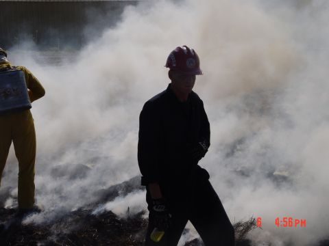 1981 Ford Bronco - Firefighters are seen in a smoky environment, possibly during a controlled burn or training exercise.