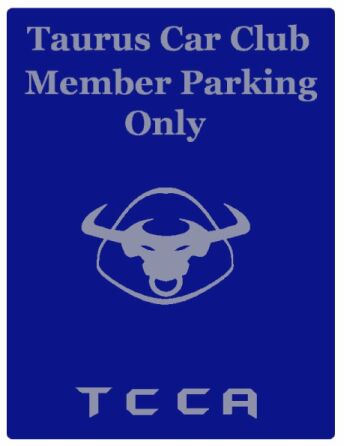 1999 Ford Taurus - This sign indicates reserved parking for members of the Taurus Car Club, a bull emblem.