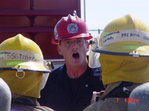 1981 Ford Bronco - Firefighters in helmets, some with names like SSGT KENNEY and PFC DIVIN, are seen during a training exercise.