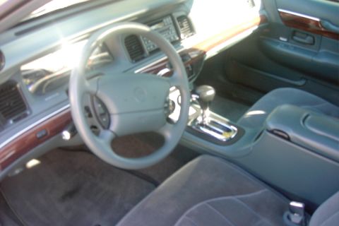 1996 Mercury Grand Marquis - Interior view of a car, showing the dashboard, steering wheel, and seats.