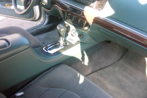 1996 Mercury Grand Marquis - The interior of a car is shown, focusing on the center console and dashboard area.