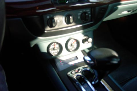 1996 Mercury Grand Marquis - Interior view of a car's dashboard, highlighting the gauges and center console.