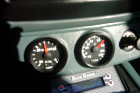 1996 Mercury Grand Marquis - Close-up of dashboard gauges and a Scan Gauge unit.