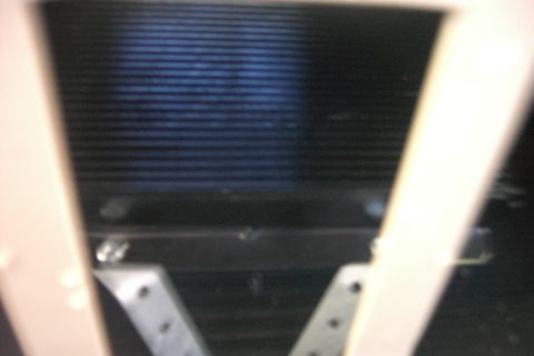 1996 Mercury Grand Marquis - Aweful shot of my new B&M transmission cooler It is dead center of the car, in front of the condensor. It is bolted to the steel brace in b…