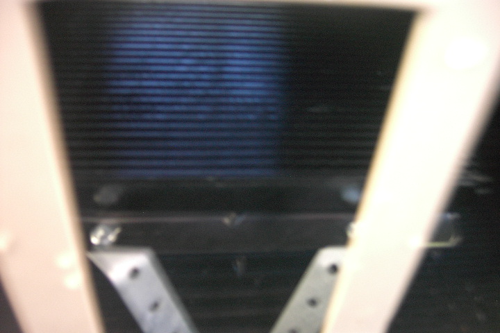 Aweful shot of my new B&M transmission cooler

It is dead center of the car, in front of the condensor. 

It is bolted to the steel brace in bumper cover, as well as the core support. It feels very solid and secure.