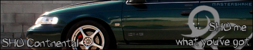 1993 Ford Taurus SHO Continental side view, green paint, custom wheels, text overlay