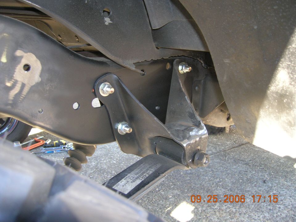 Moved forward hangers back 1 1/4 inches. Improved tire clearance and better shackle angle.