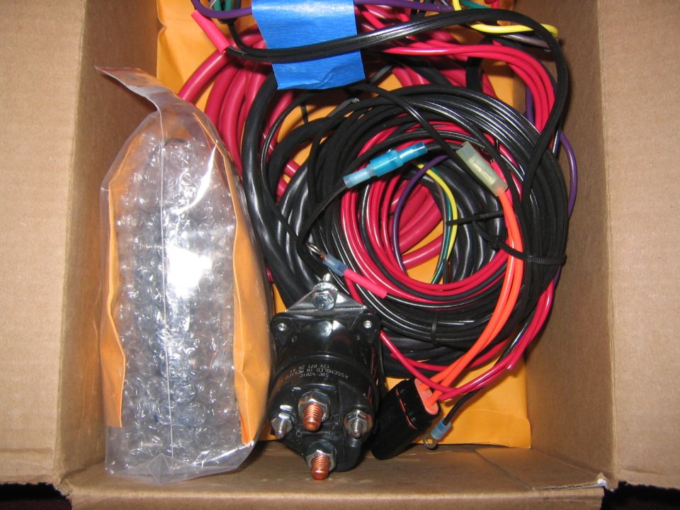 Theres the 20 circuit fuse box on the left packaged up and then the huge relay for the dual batteries is right there....