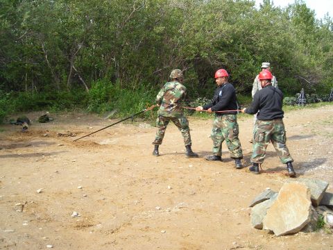 2003 Jeep TJ - Soldiers train with ropes in an outdoor setting, possibly for a rescue or tactical exercise.