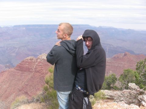 1995 Ford Probe - Two young men pose for a photo at the Grand Canyon, with a vast canyon landscape behind them.