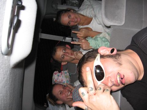 1995 Ford Probe - Friends are making faces and giving the finger while riding in the back of a vehicle.