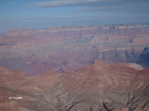 1995 Ford Probe - A scenic view of the Grand Canyon, captured on February 11, 2005, also the Supermotors.net logo.