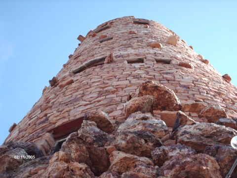 1995 Ford Probe - A stone tower with a unique architectural design stands tall against a clear blue sky.