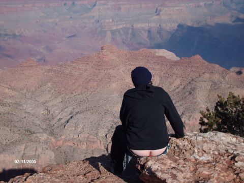 1995 Ford Probe - A person sits on a rock overlooking a vast canyon, with a date stamp and website watermark visible.