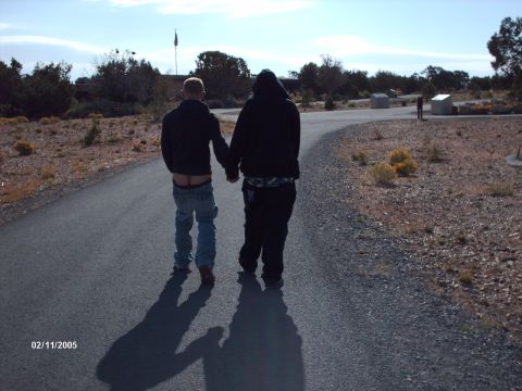 1995 Ford Probe - Two individuals stroll down a paved path in a scenic outdoor location, with a date stamp indicating February 11, 2005.