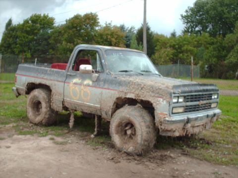 1991 Chevrolet Blazer - This heavily mud-caked pickup truck appears to be from the 1980s, not a 1991 model.