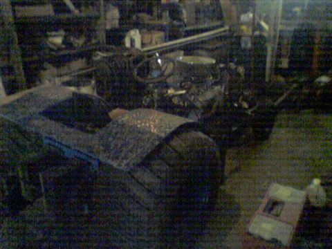 1991 Chevrolet Blazer - Interior view of a car with engine components in the background, likely in a workshop.