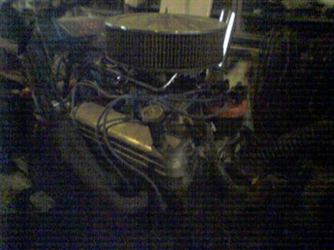 1991 Chevrolet Blazer - Close-up view of a V8 engine, showing the air filter and spark plug wires.