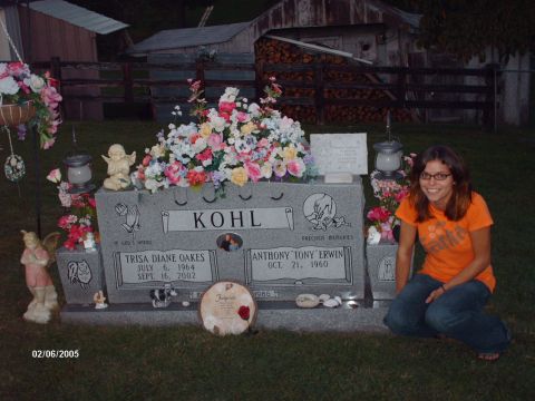 1995 Ford Probe - A woman poses by a gravestone adorned with flowers, dated 02/06/2005.