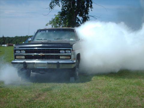 1991 Chevrolet Blazer - This Chevrolet pickup truck is doing a burnout, creating a massive smoke screen.