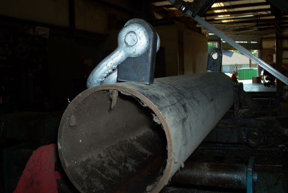 Metal pipe with tow hook attachment