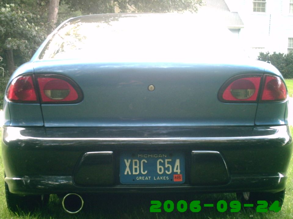 Rear of blue sedan with Michigan license plate XBC 654