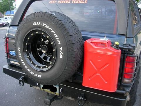 1993 Ford Bronco - Rear view of a 1993 Ford Bronco equipped with a spare tire, gas can, and a "JEEP RESCUE VEHICLE" sticker.