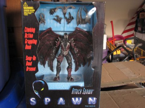 1991 Ford Bronco - This is a photo of an "Attack Spawn" action figure from "The Movie" in its packaging.